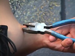 Gorgeous young girl in a bdsm corset is whipped all round pliers